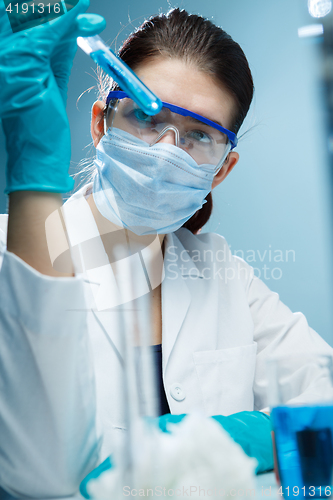 Image of Woman with tubes in lab