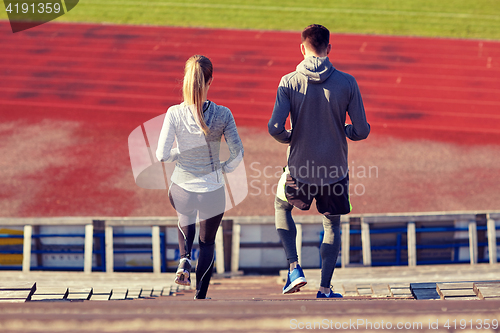 Image of couple walking downstairs on stadium