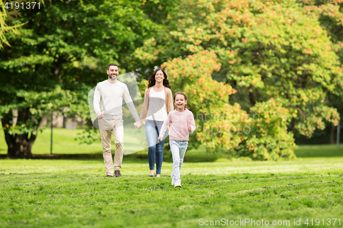 Image of happy family walking in summer park and having fun