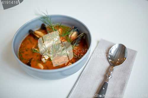 Image of seafood soup with fish and blue mussels in bowl