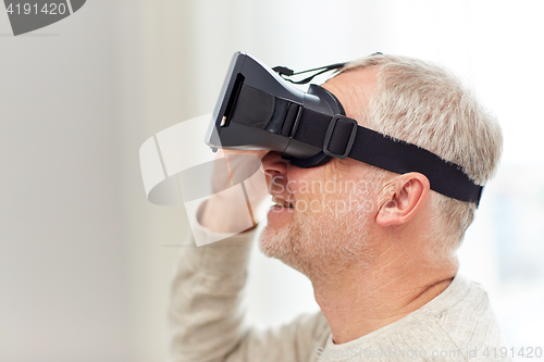 Image of old man in virtual reality headset or 3d glasses