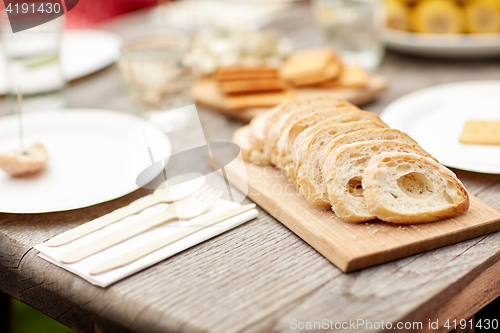 Image of table with food for dinner at summer garden party