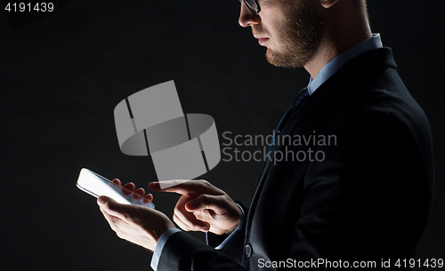 Image of close up of businessman with glass smartphone