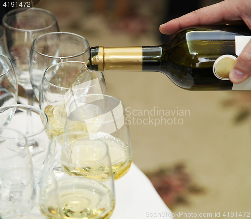 Image of Pouring white wine