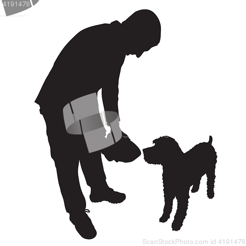 Image of Man Feeding Dog