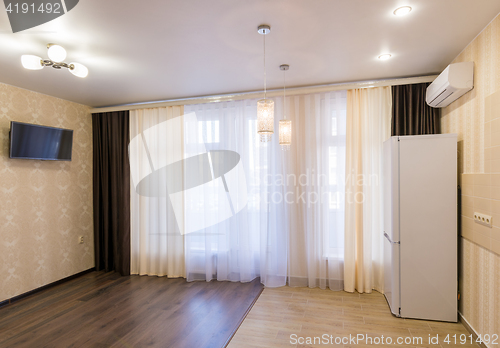 Image of The interior of a small room with kitchen, renovated, unfurnished