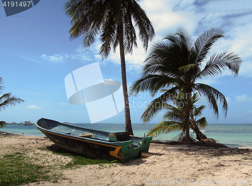 Image of old fishing boat beach with palm trees North End Big Corn Island