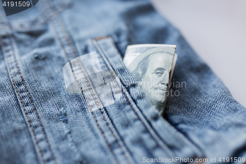 Image of dollar money in pocket of denim jacket