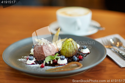 Image of chocolate ice cream dessert on plate at restaurant