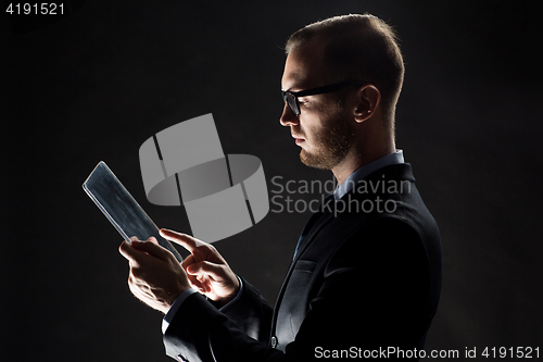 Image of close up of businessman with transparent tablet pc