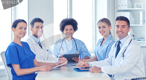 Image of group of happy doctors meeting at hospital office