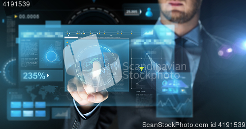 Image of businessman touching virtual screen projection