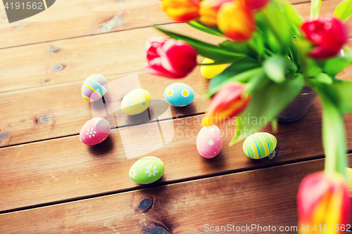 Image of close up of easter eggs and flowers in bucket