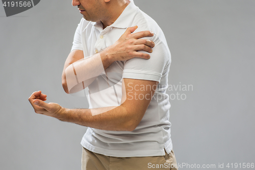 Image of close up of man suffering from pain in hand