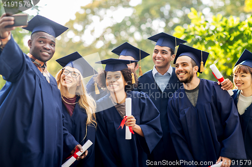 Image of students or bachelors taking selfie by smartphone
