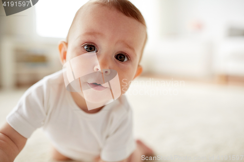 Image of close up of happy little baby boy or girl at home