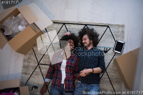 Image of Top view of attractive young multiethnic couple