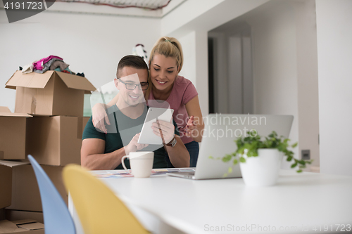 Image of Young couple moving in a new home