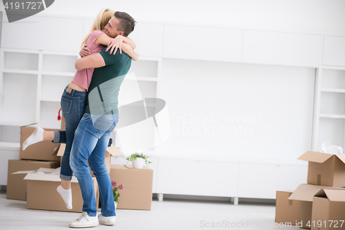 Image of happy Young couple moving in new house