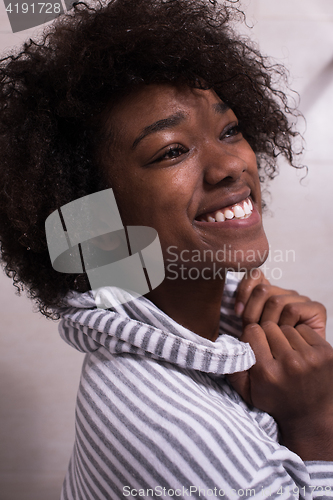 Image of beautiful black woman wearing  bathrobe