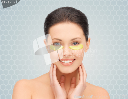 Image of beautiful young woman face with under-eye patches