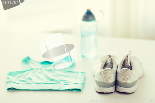 Image of close up of female sports clothing and bottle set