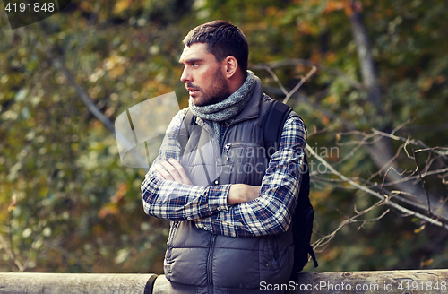 Image of man with backpack outdoors