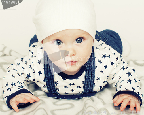 Image of little cute baby toddler on carpet isolated close up smiling ado