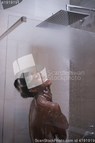 Image of African American woman in the shower