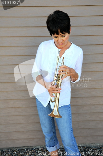 Image of Female trumpet player.