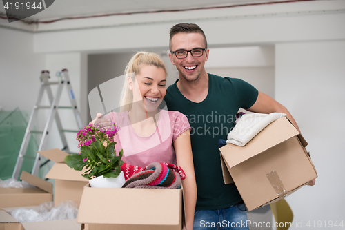 Image of young couple moving into a new home