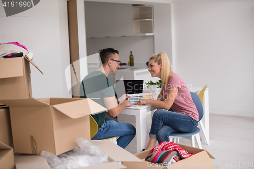 Image of Young couple moving in a new home