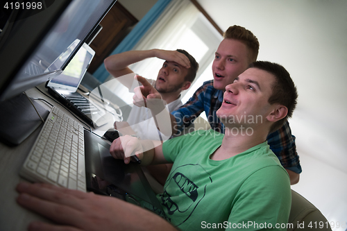 Image of a group of graphic designers at work