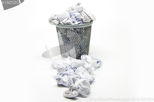 Image of Garbage bin with paper waste