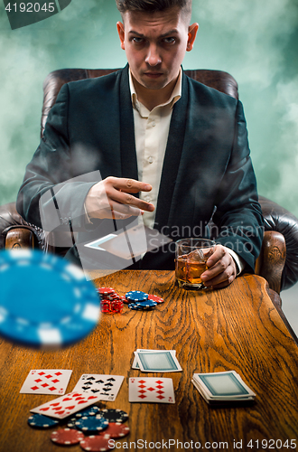 Image of The chips for gamblings, drink and playing cards