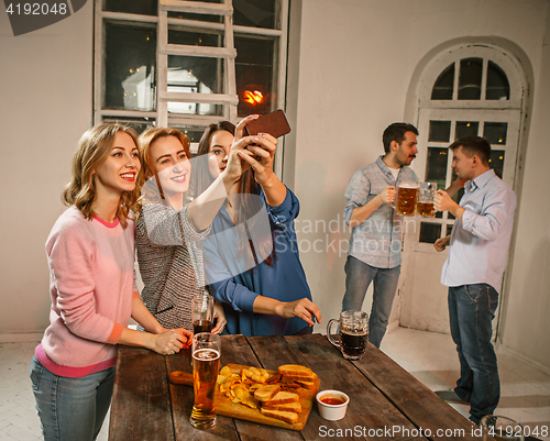 Image of Group of friends girls making selfie photo