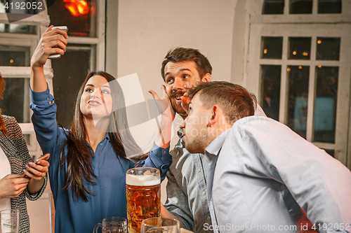 Image of Group of friends girls making selfie photo