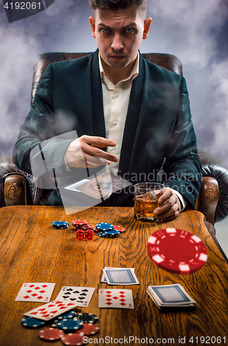 Image of The chips for gamblings, drink and playing cards