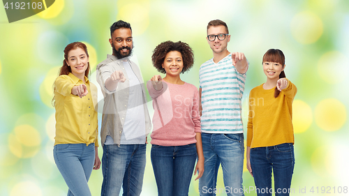 Image of international group of people pointing on you