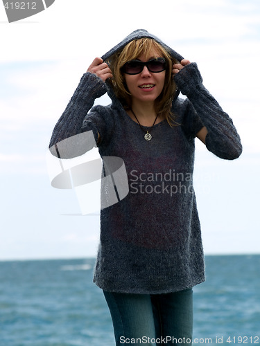 Image of Blond Model in Hood Posing beach