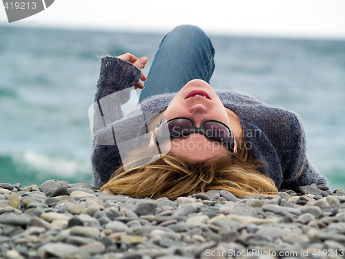 Image of Young lady on Beach Resting