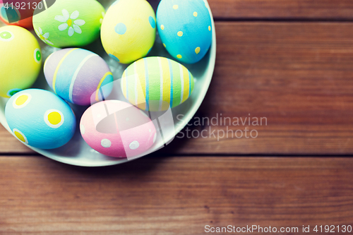 Image of close up of colored easter eggs on plate