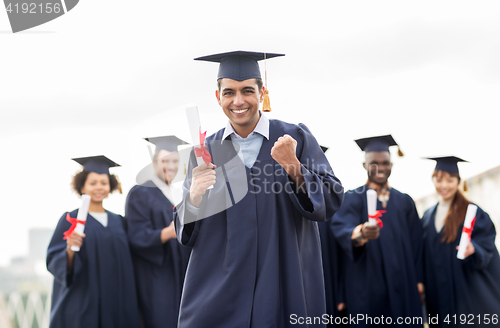 Image of happy student with diploma celebrating graduation