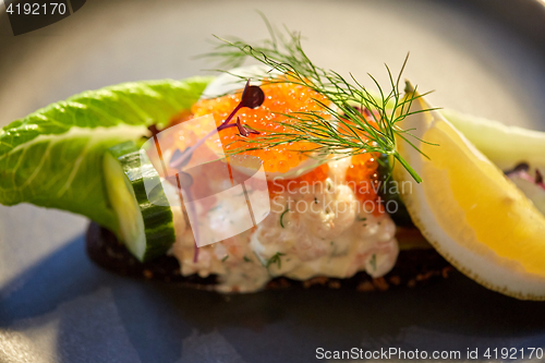 Image of close up of toast skagen with caviar and bread