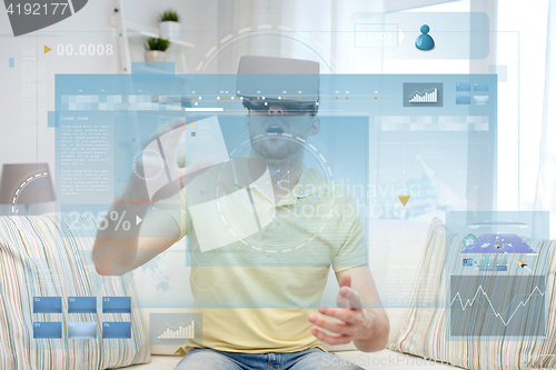 Image of young man in virtual reality headset or 3d glasses