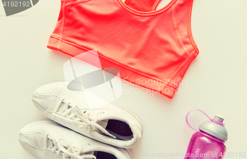 Image of close up of female sports clothing and bottle set