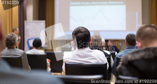 Image of Male speeker having talk at public event.