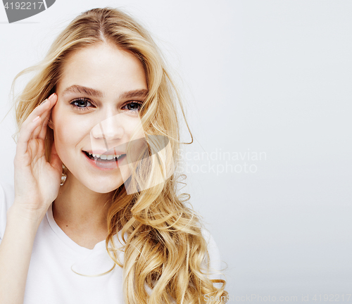 Image of young pretty blond teenage girl emotional posing, happy smiling isolated on white background, lifestyle people concept