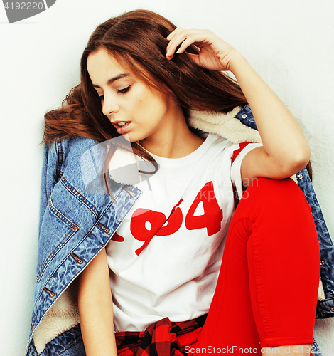 Image of young pretty teenage hipster girl posing emotional happy smiling on white background, lifestyle people concept 