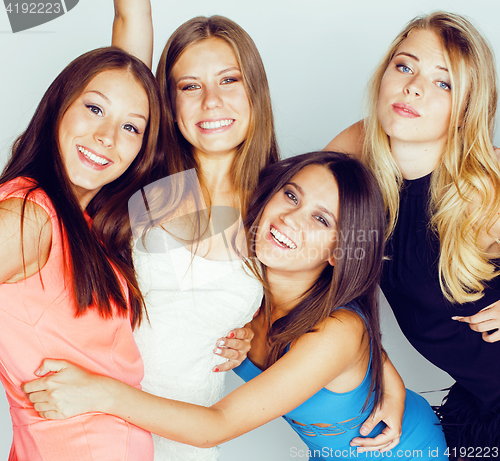 Image of group of many cool modern girls friends in bright clothers together having fun isolated on white background, happy smiling lifestyle people concept